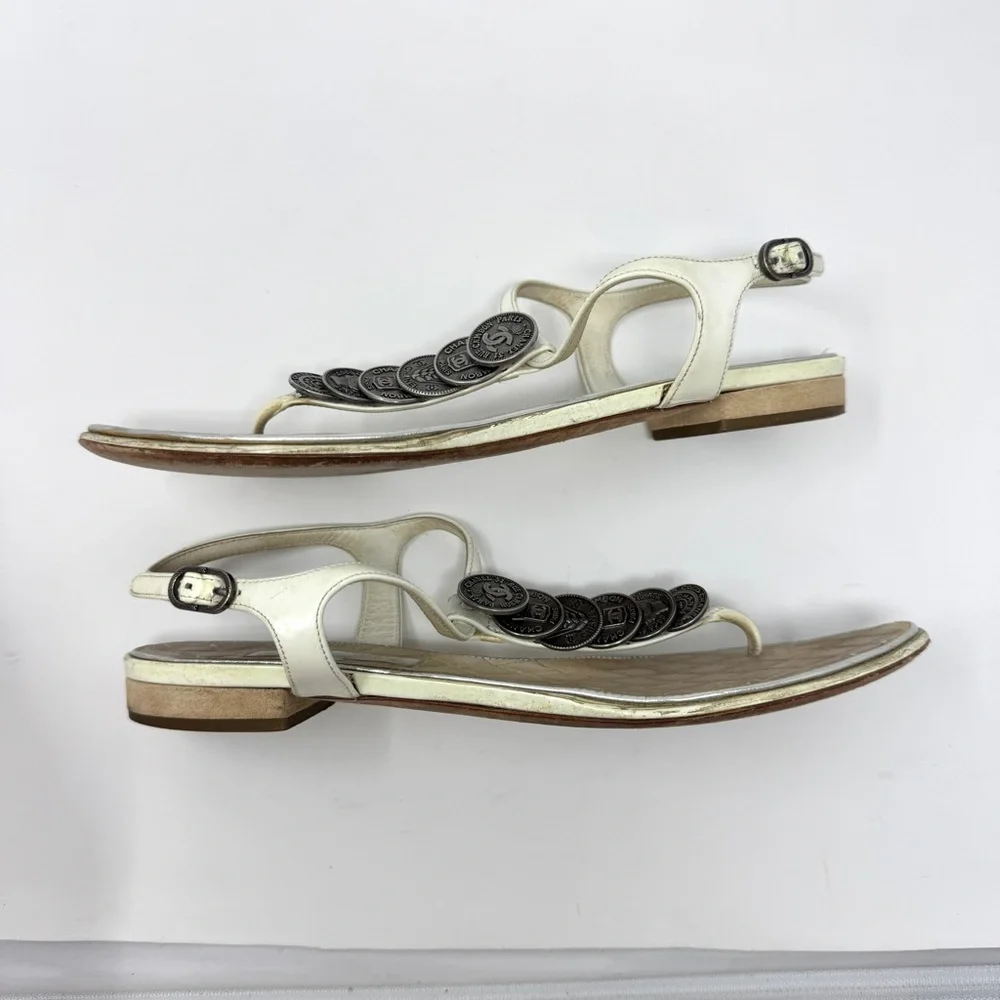 CHANEL White Leather Thong Sandals with Stacked Silver Coin Medallions